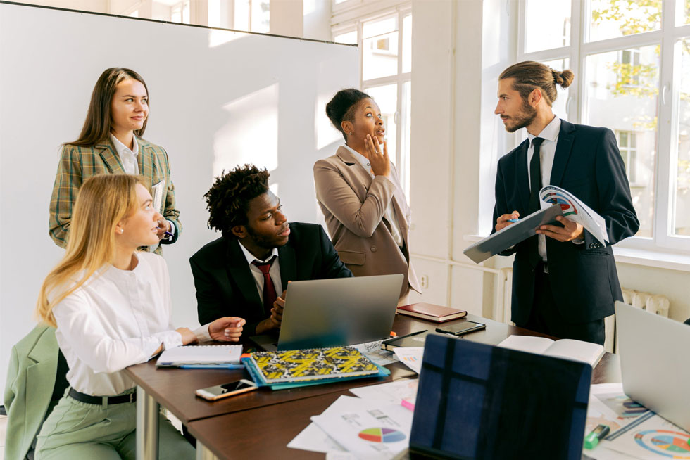 A group of employees attending their onboarding orientation