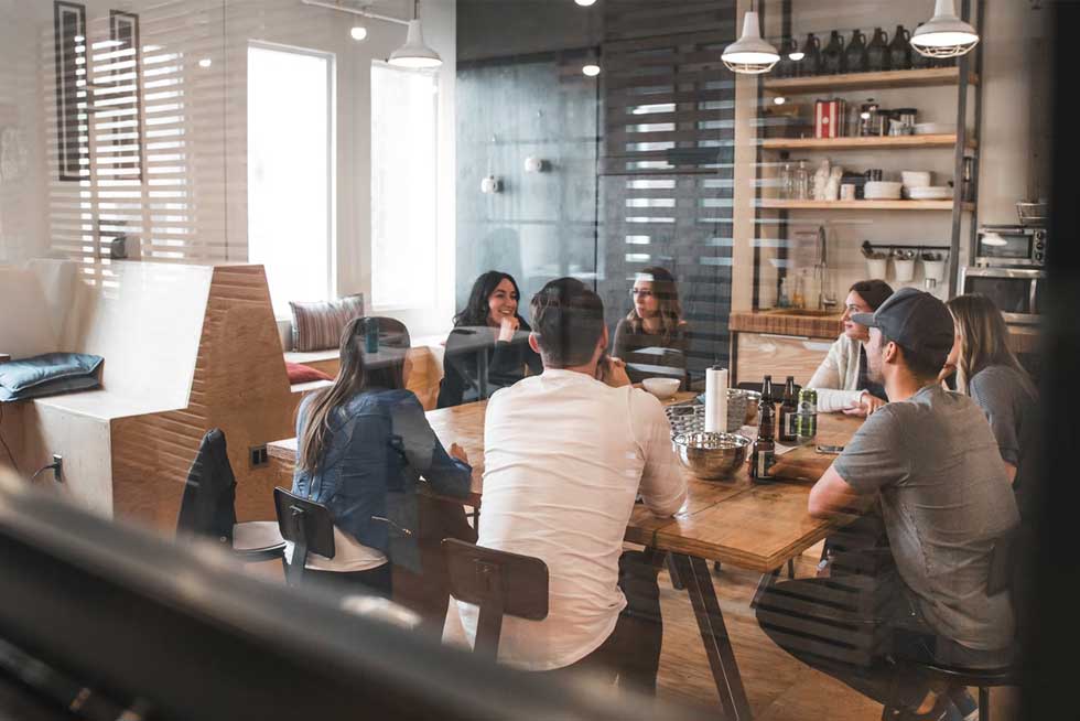 Employees discussing first impression during a lunch and learn