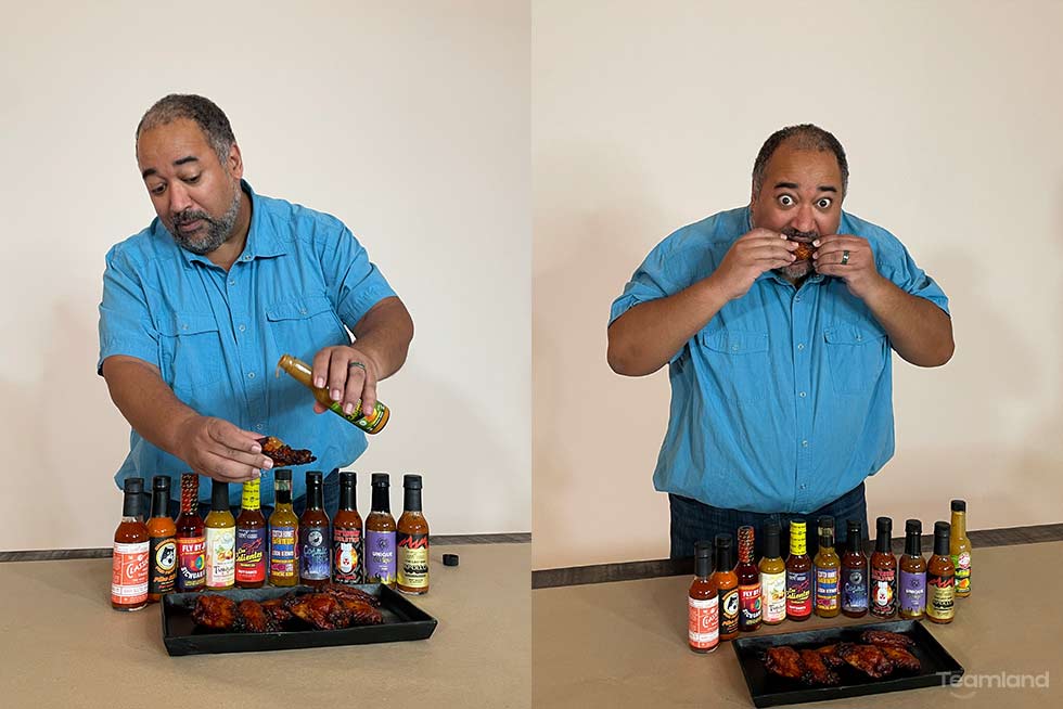 Picture of person eating chicken wings with hot sauce for Teamland Hot Ones team building event